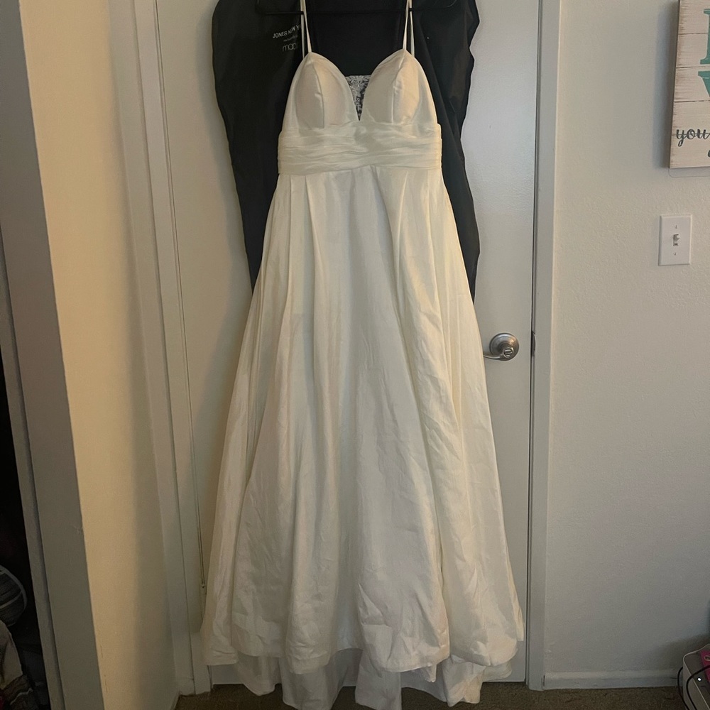 Wedding dress. Spaghetti strap A-line ball gown style dress. Worn once, cleaned.